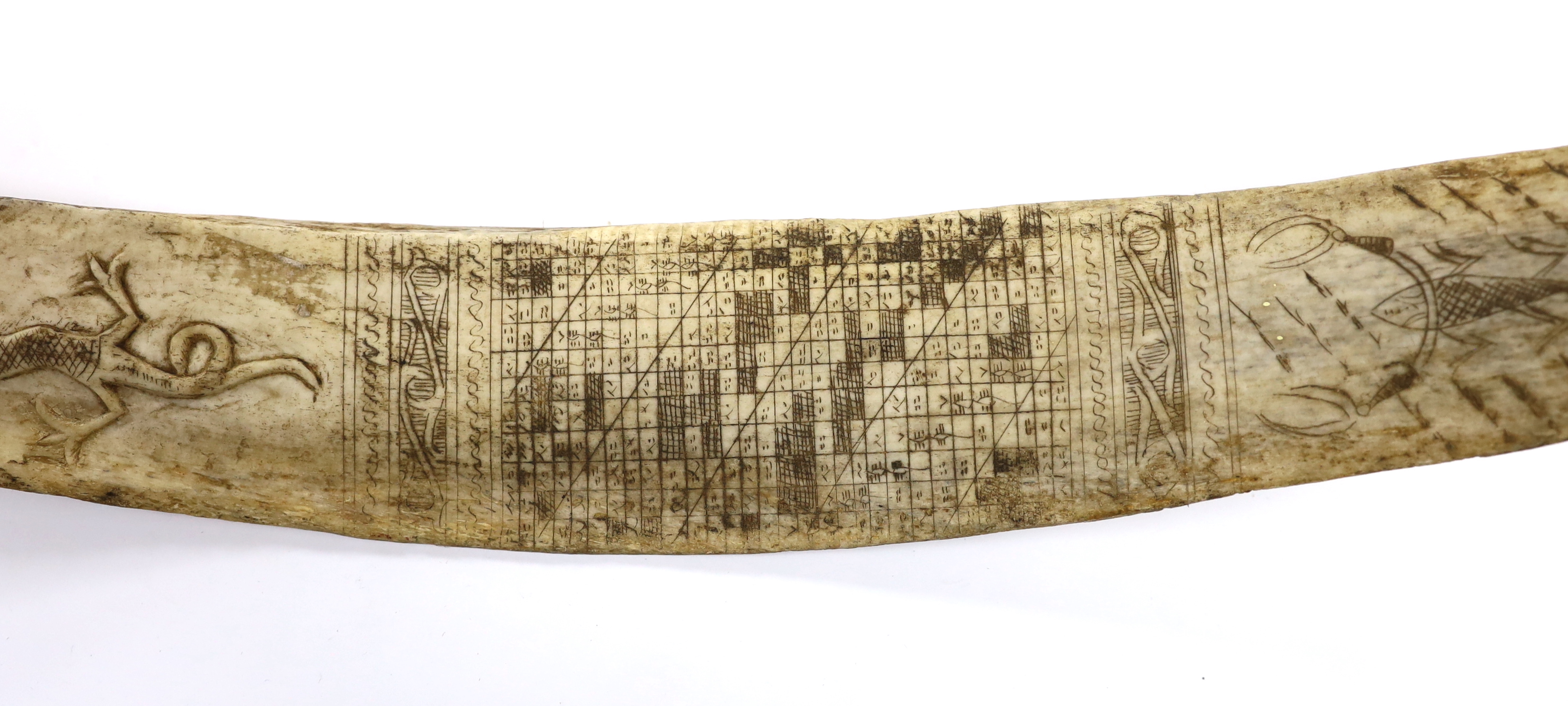 A late 19th/early 20th century Indonesian, Sumatran, carved buffalo rib calendar, Batak, 37cm